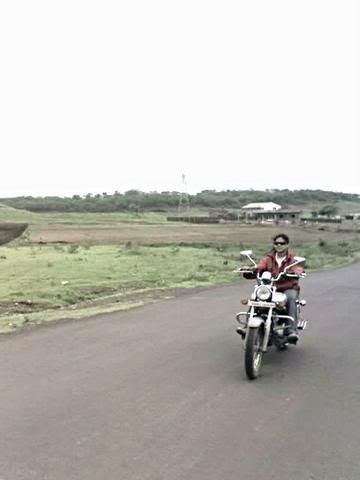 un known girl driving her bike