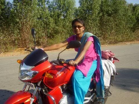 A Girl driving on her bike on Delhi Street